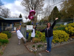 Grace Children's Center staff celebrating their Early Achievers rating outside the center